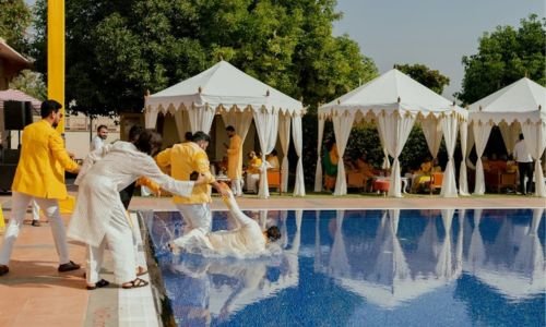 Luxury Haldi ceremony setup at poolside venue of Grand Mantram Resort in Gurgaon with vibrant decorations and festive seating