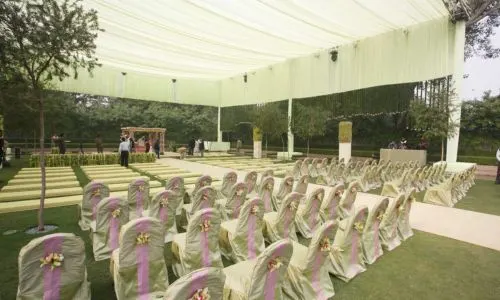 Day wedding lounge with light green theater-style seating arrangement at Grand Mantram Resort, Gurgaon