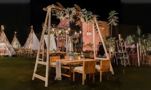 Rustic seating arrangement with decorative hangings for Sangeet and Cocktail Night at Grand Mantram Resort in Gurgaon